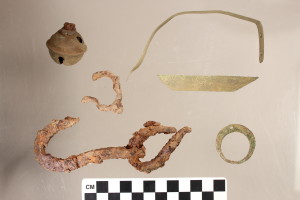 Images of artifacts discovered at the Nipsachuck Battle site, including iron pieces, scrap brass, and other domestic items. 